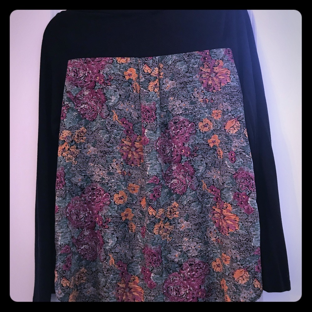 Navy blue v-neck shirt with floral print back